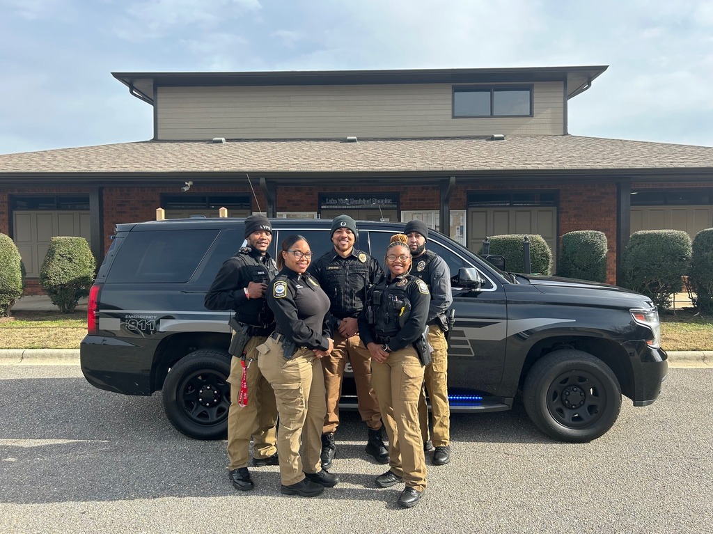 City of Lake View Alabama Police officers standing in front of police vehicle in front of Municipal Complex