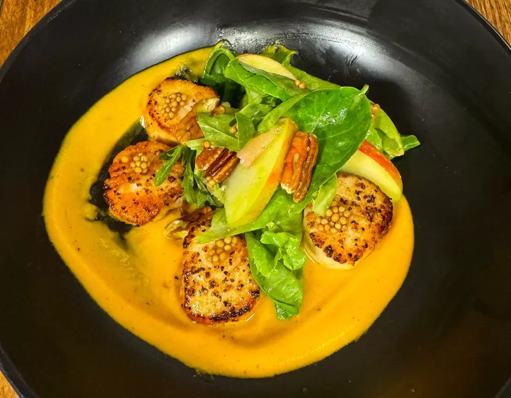 Fresh Sea Scallops with sweet potato puree and apple pecan salad at Bolo Restaurant, Orange Beach