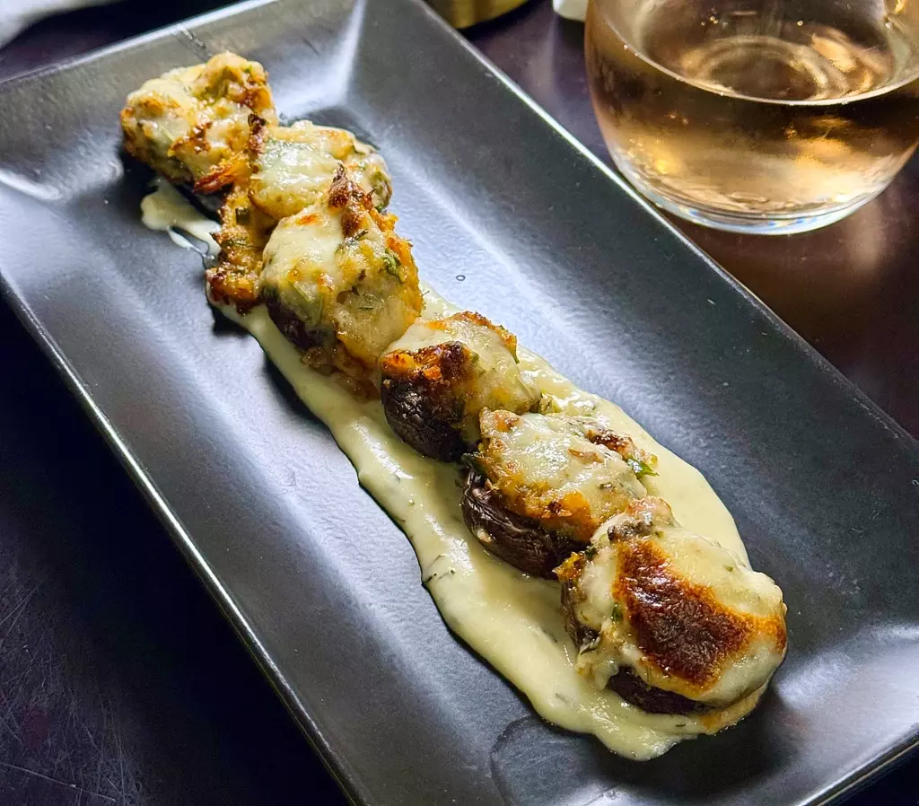 Crab Stuffed Mushrooms: Baby Portabella mushrooms stuffed with crab meat, panko, and garlic parmesan cream in Orange Beach, Alabama